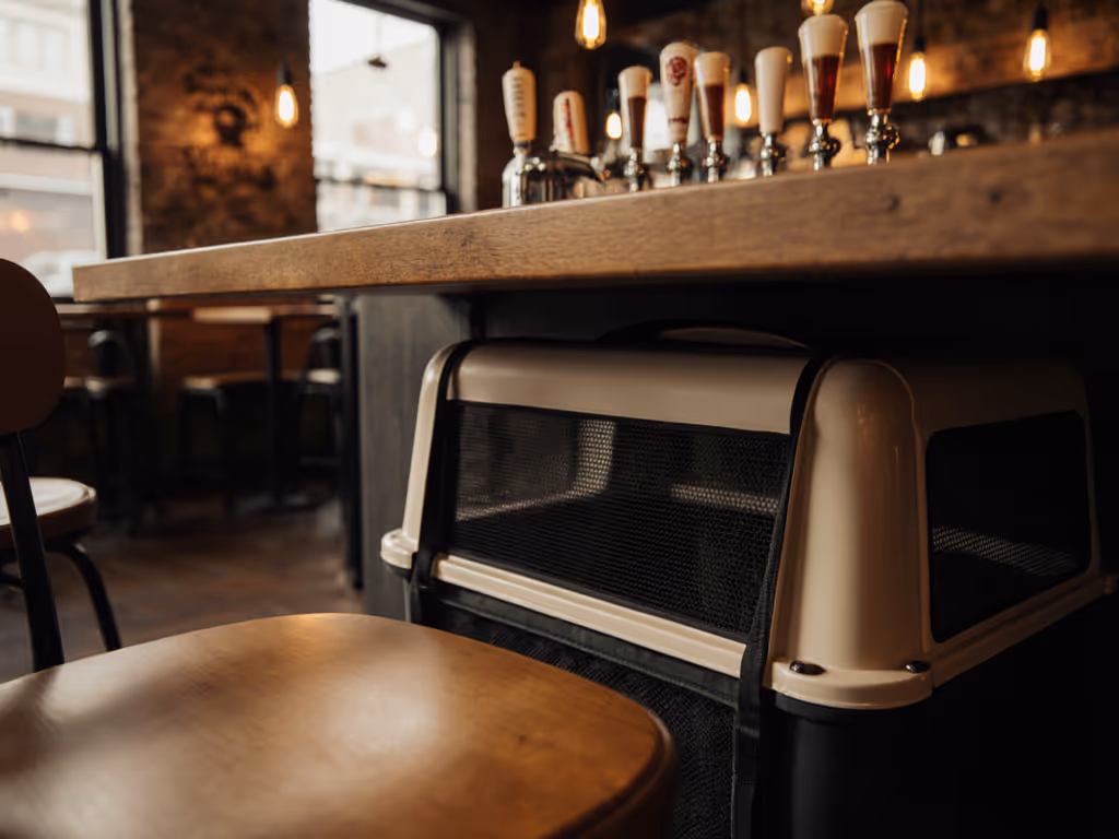 pet_in_discreet_carrier_under_table_at_brewery